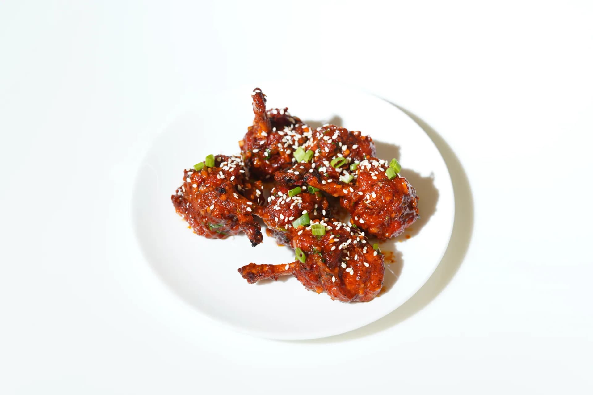 Glazed chicken finished with sesame and fresh herbs